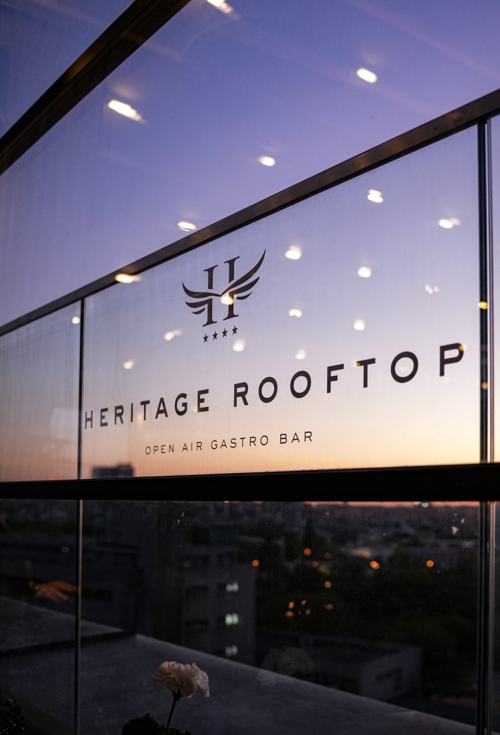 Heritage Rooftop logo above the Belgrade panorama